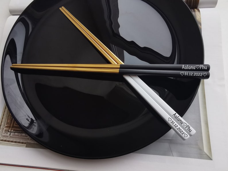 Black and gold chopsticks with personalised name and date