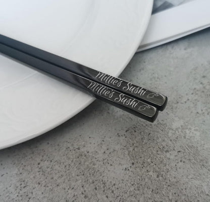 Black chopsticks with engraved name and sushi motif