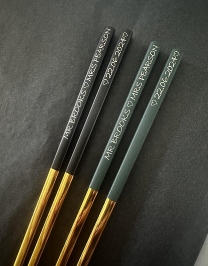 Black and gold and green and gold chopsticks with name and date engraving