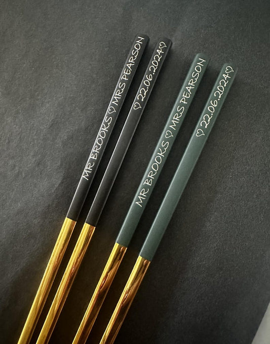Black and gold and green and gold chopsticks with name and date engraving