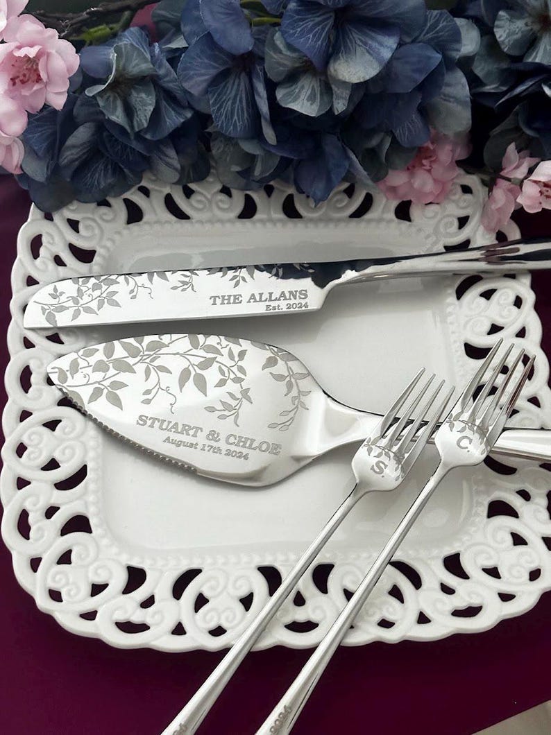 Silver wedding cake knife, server and forks with leaf engraving