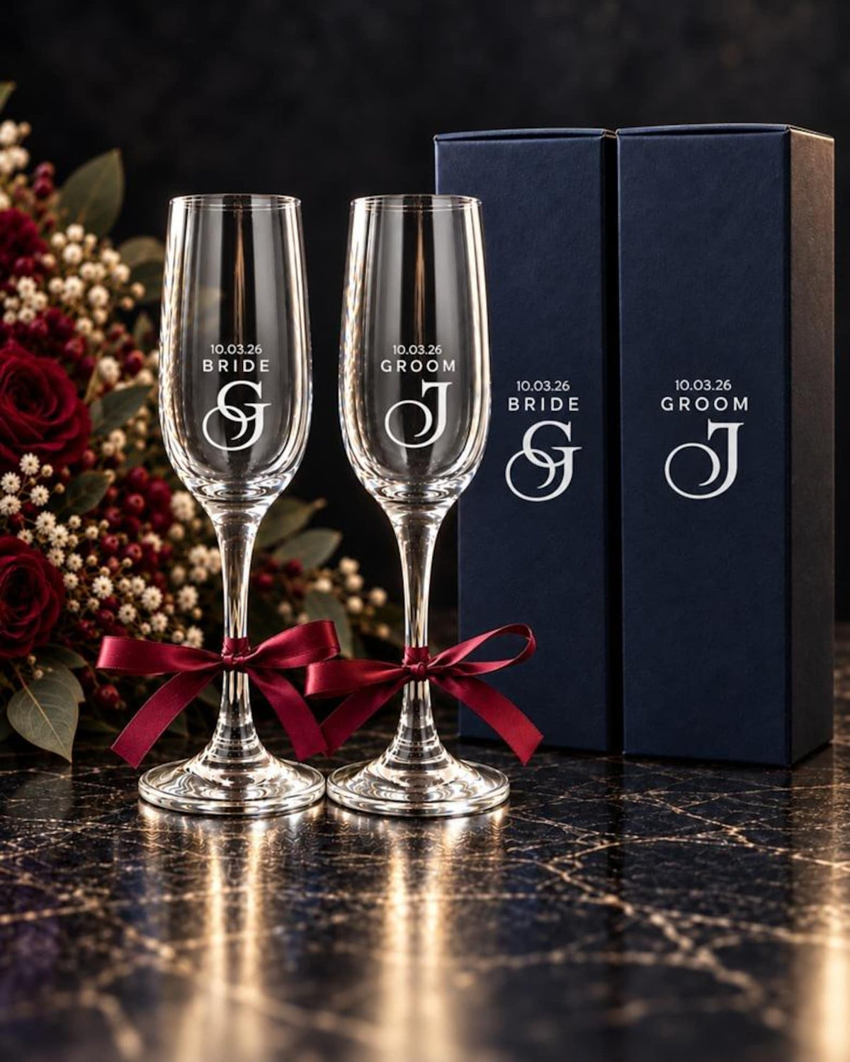 Bride and Groom engraved champagne flutes with burgundy ribbons and two individual gift boxes