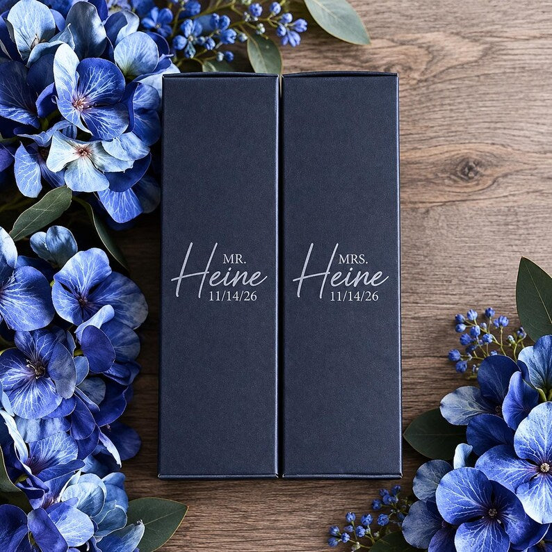 Individual black gift boxes personalized for a pair of champagne flutes